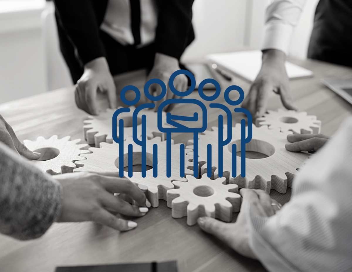 Black and white image with four people placing cogs together on a table. A group of blue stick figures standing in a group is overlaid on top of the black and white image.